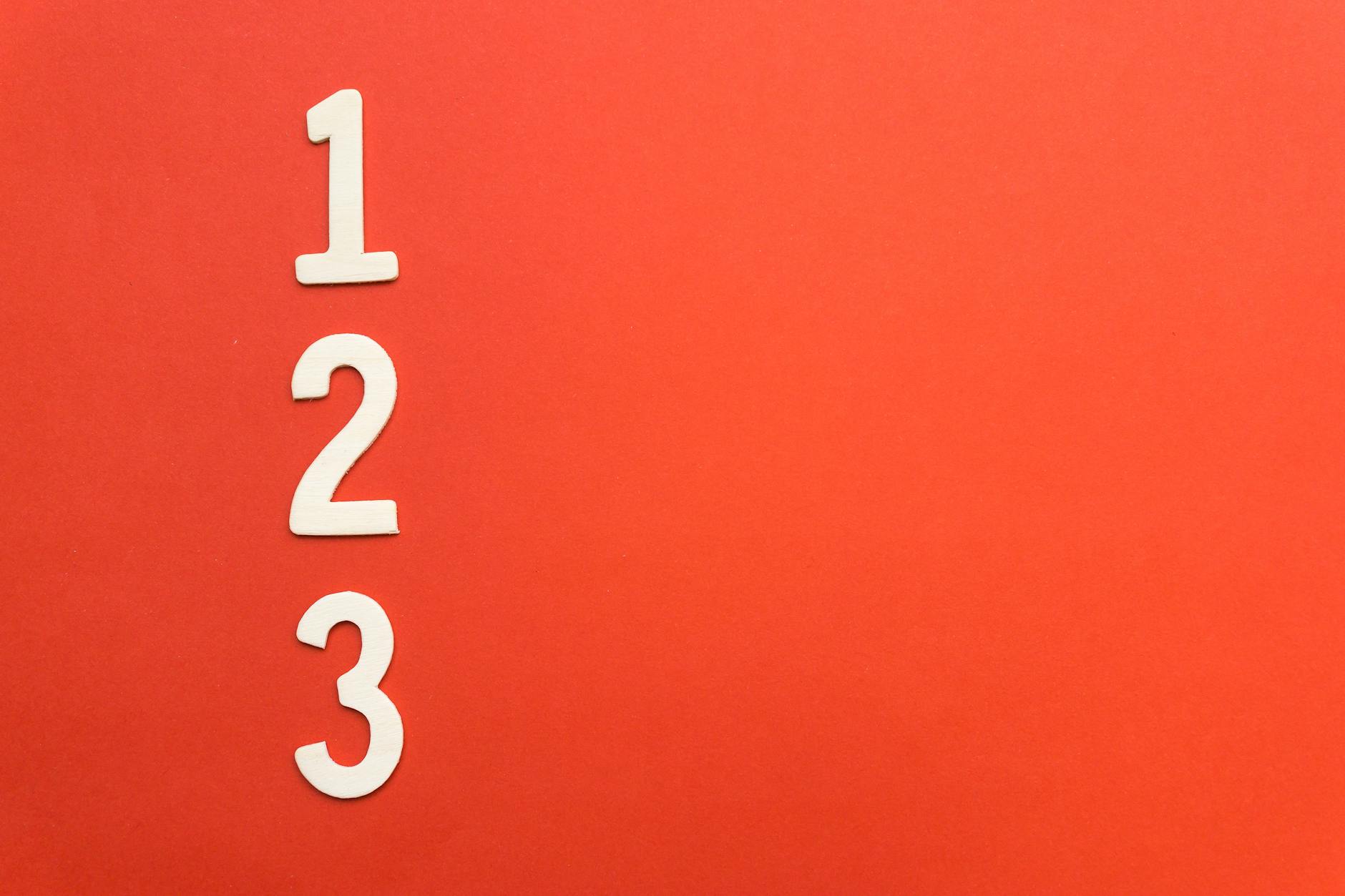 Counting numbers 1 to 3 on a vibrant red background, ideal for design projects.